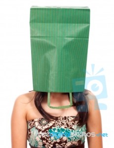 ashamed-girl-with-a-bag-on-her-head-10054806